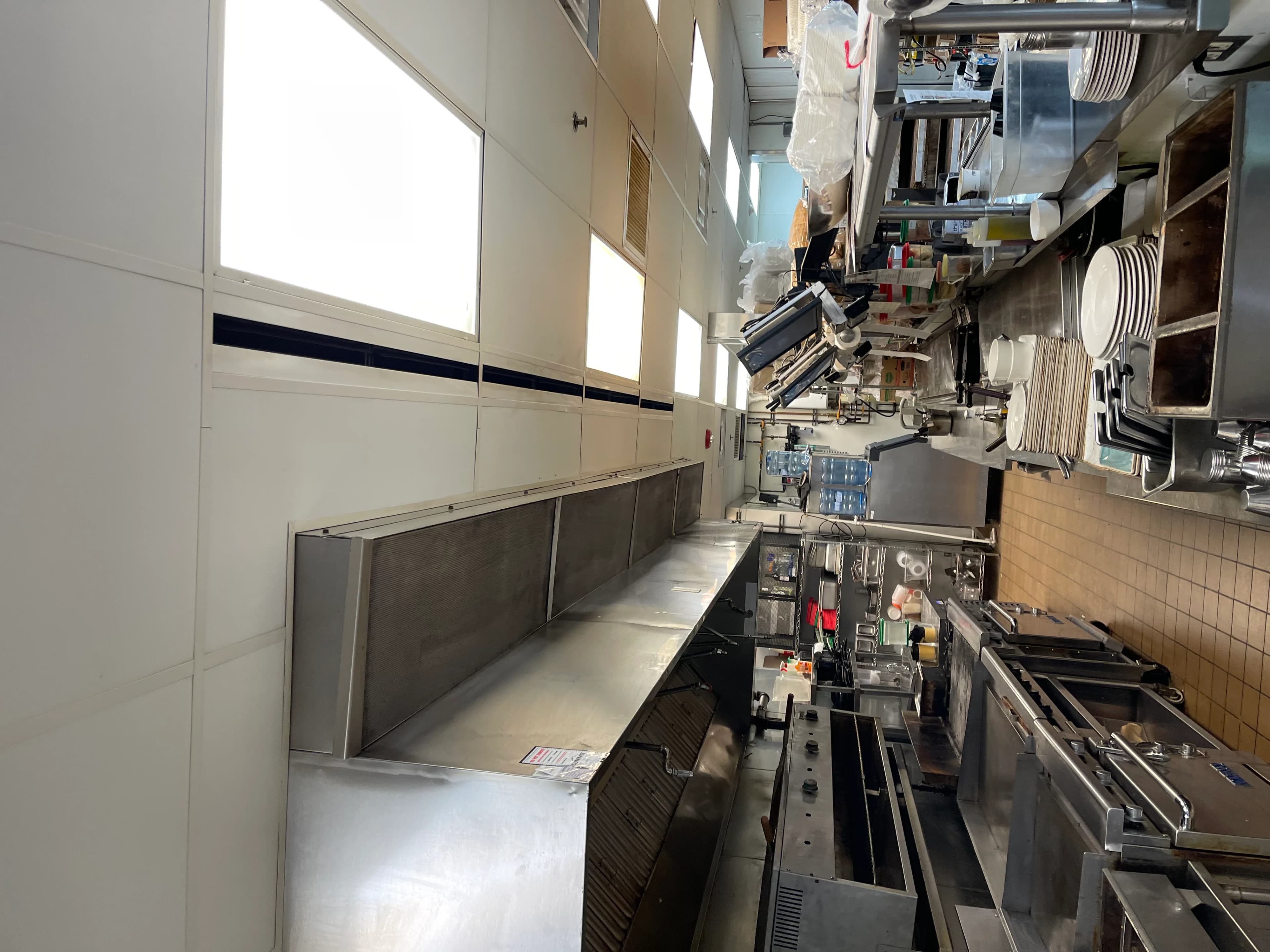 Commercial cook line and ovens serviced in a full-service restaurant kitchen